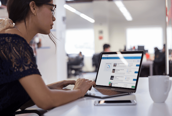 Staff Training On Macbook with Woman